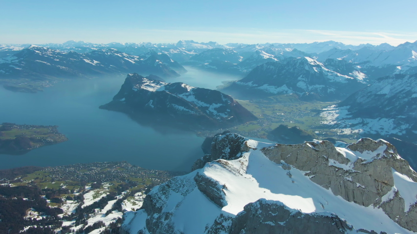 Mountain Pilatus and Lake Lucerne in Sunny Winter Morning. Swiss Alps, Switzerland. Aerial View. Drone Flies Forward, Tilt Up. Reveal Shot | Shutterstock HD Video #1036518065