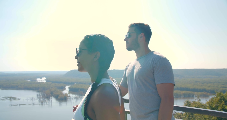 Couple at the Top of Pikes Peak, Looking Out Over Water, Iowa
