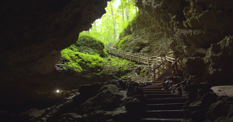 Couple Walking Down Into the Dark Maquoketa Caves, Iowa