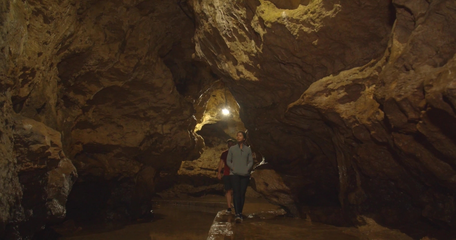 People Exploring the Underground Maquoketa Caves in Iowa