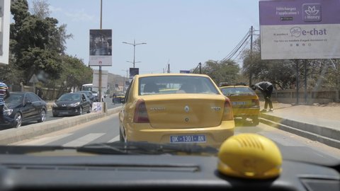 Dakar / Senegal - 03 30 2019: Taxi towards downtown Dakar - view from passenger seat