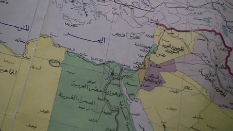 Closeup of a  map of Middle East countries 
, Globe with countries map in the Middle East in Arabic - location luxor - egypt 
4/9/2019