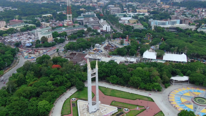 Aerial wide view of the nice green place with huge trees around Quezon Memorial Shrine and the place surround it.