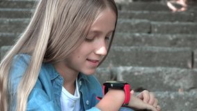 Smart Watch, Child Using Smartwatch Outdoor in Park, Kid Talking at Smartphone