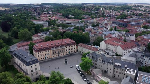Weimar town Square of Democracy and Anna Amalia library in aerial drone view. Summertime shot above historic city center in Thuringia, Germany.