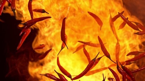 Super Slow Motion Shot of Red Chilli Peppers and Fire Explosion at 1000fps.