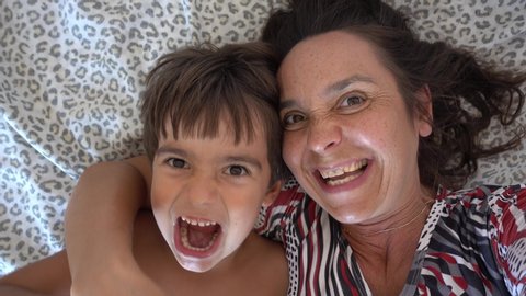 4K Selfie - Kidding around child bites hand of his yelling mother
