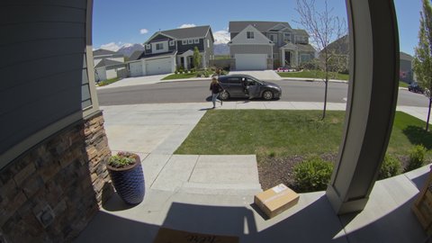 Homeowner catching thief trying to steal package from front stoop / Lehi, Utah, United States