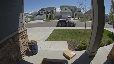 Security camera footage of woman stealing package from front stoop / Lehi, Utah, United States