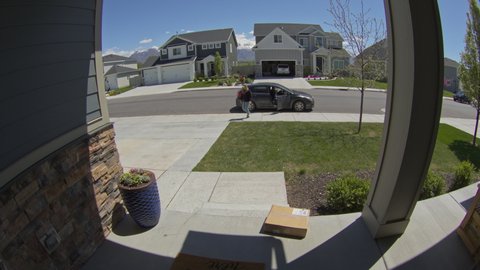 Security camera footage of startled thief running from front stoop / Lehi, Utah, United States