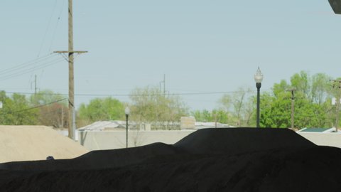 Slow motion of silhouette of boys jumping hills on bicycles at bike park / Salt Lake City, Utah, United States