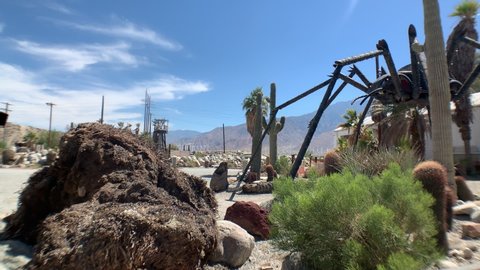 Palm Springs, California / United States - July 12, 2019: Giant VW Beetle Spider sculpture guards repair shop, Palm Springs California
