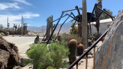 Palm Springs, California / United States - July 12, 2019: Giant VW Beetle Spider sculpture guards repair shop, Palm Springs California