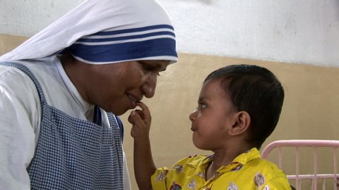 Kolkata / India - 08 14 2019: Nun Being Playful With Child At Orphanage In Kolkata