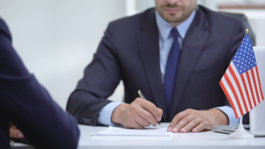 US official signing contract for international cooperation, shaking partner hand Royalty-Free Stock Footage #1036588967