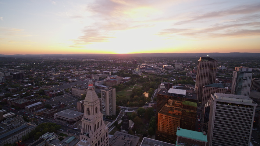 Hartford Connecticut Aerial v3 Quick panning view of downtown at sunset moving backwards - October 2017