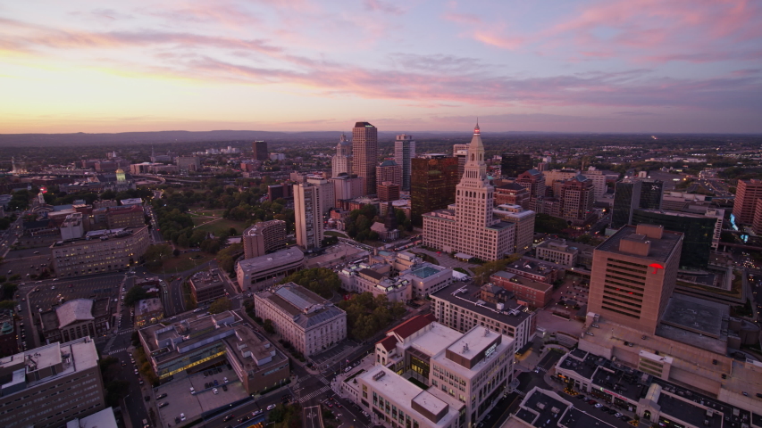 Hartford Connecticut Aerial v5 Traveling panoramic view of downtown with Connecticut river in backdrop - October 2017 Royalty-Free Stock Footage #1036604402