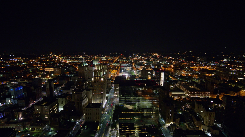 Newark New Jersey Aerial v2 Panning cityscape to reverse with view of downtown Newark at night - October 2017