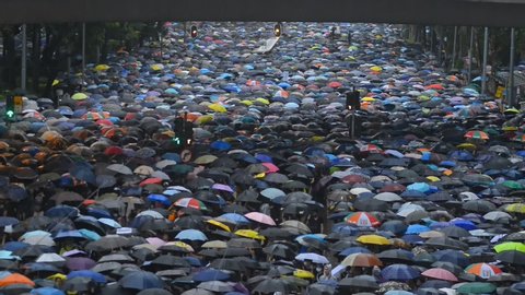 Hongkong, China - August 2019: background top view 2019 asia business people crowd. concept american propaganda woman and asian man protest with umbrella. voice political rally about gdpr resistance