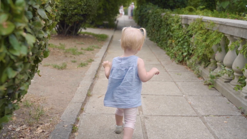 Little baby girl spending her summer day outdoor