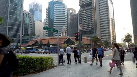 Pedestrians, Cars and City Skyline During Rush Hour at Central Boulevard in Business District of Singapore - August, 2019