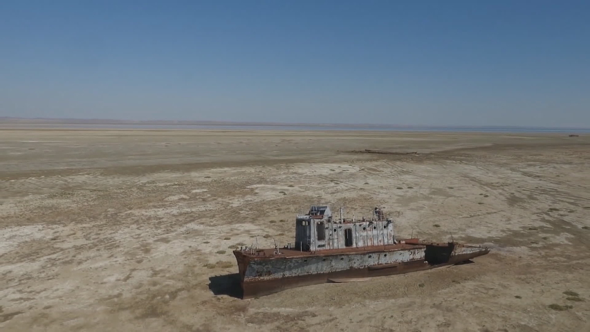 rusty ship on the bottom of a dried-up Aral Sea Royalty-Free Stock Footage #1036625729