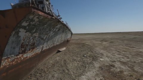 rusty ship on the bottom of a dried-up Aral Sea