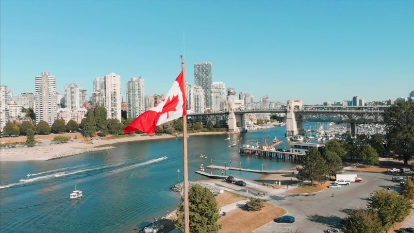 Canadian flag, Granville bridge, downtown vancouver, beach, boats.
