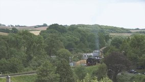 A 4K video from above of the old steam railway near Corte Castle that goes to Swanage beach town in Dorset, Southern England, United Kingdom.