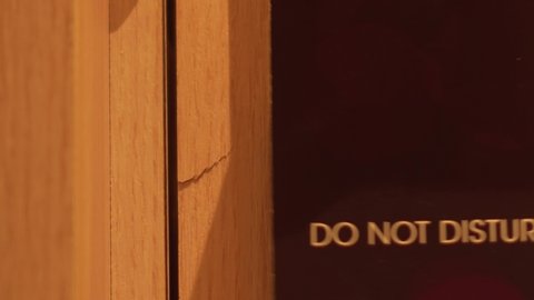 'Do Not Disturb' Sign Hanging From Outside Hotel Room, 4K