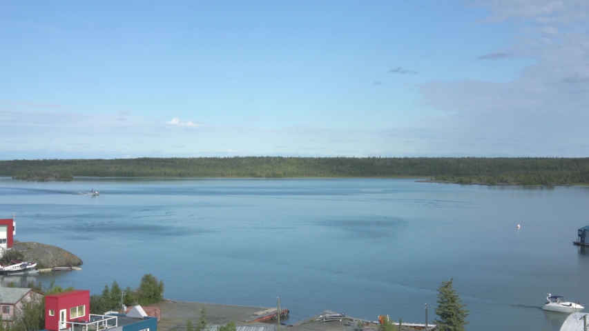 A seaplane sliding on Yellowknife Bay, viewed from the top of the Pilot