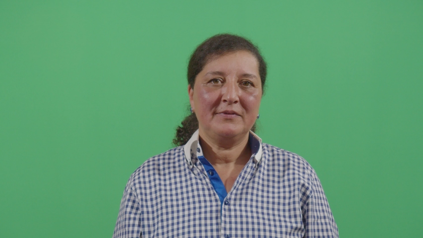 woman pimple popping looking at the camera in ecuador