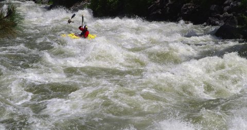 Banks , Idaho / United States - 06 04 2017: Aniol Serrasolses kayaks down the North Fork of the Payette River in Idaho.