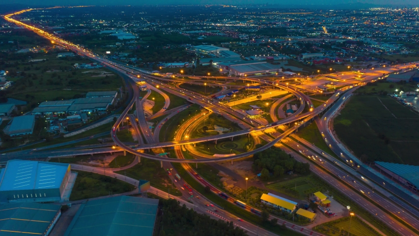 4K Aerial Hyperlapse Time-lapse. The traffic of ring roads, expressways, motorways, and highways at night. Public transport or commuter city life concept Royalty-Free Stock Footage #1036688183