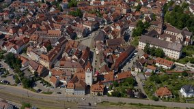 Aerial view of the old town of Gengenbach in Germany  on a sunny day in summer. Zoom in on the entry tower.