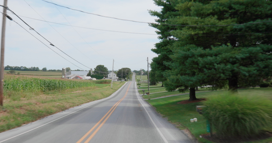 Drive Through Scenic Rural Farmland with Corn, Barn and Silos