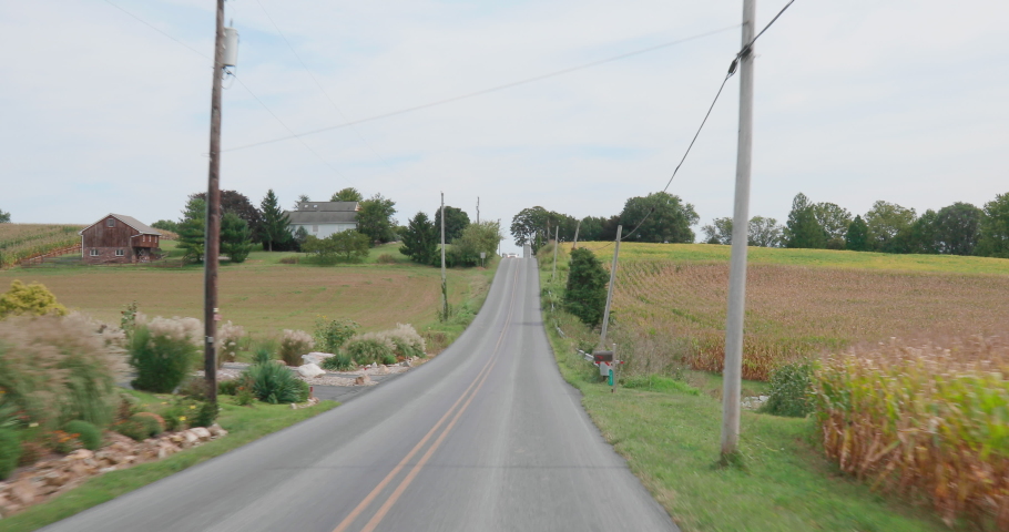 Drive Through Scenic Rural Farmland with Barn, Silos and Truck