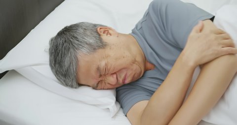 asian elder man tossed and turned all night