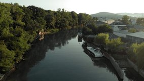 Landscape. Boats on the river in a mountain valley. Aerial Video Filming