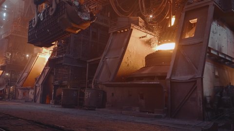 Iron Foundry. Long Shot. A huge amount of sparks poured out of a steel furnace under pressure.