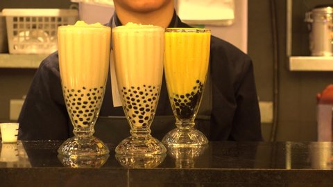 Taiwanese traditional drink, “BUBBLE TEA (also known as pearl milk tea, bubble milk tea, or boba)”. It is a Taiwanese tea-based drink with chewy tapioca balls.