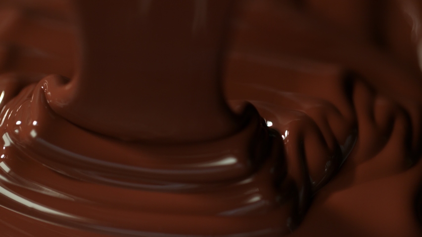 Super slow motion of pouring dark hot chocolate. Filmed with cinema high speed camera, 1000fps. Royalty-Free Stock Footage #1036742468