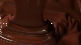 Super slow motion of pouring dark hot chocolate. Filmed with cinema high speed camera, 1000fps. - Powered by Shutterstock - Get 15% off with code: PIKWIZARD15
