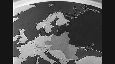 CIRCA 1930s - An animated map shows the spread of Communism and a parade in Bulgaria celebrates the conversion the country to that political theory.