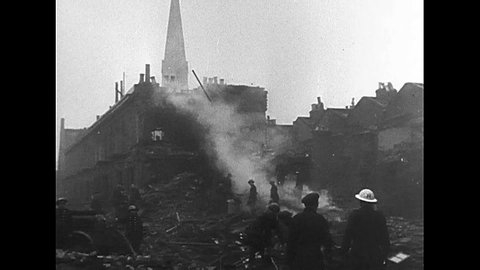 CIRCA 1940s - British civilians make their way through ruins in the aftermath of a Nazi air raid, during World War 2, in 1940.