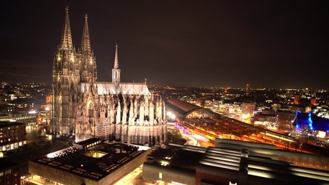 Cologne Cathedral from a Drone at Sunset and Night with view to Musical Dome and Train Station