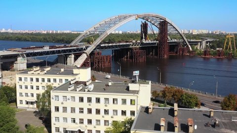 Arch bridge under construction over the river Dnepr