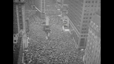 CIRCA 1940s - Crowds throng Times Square to celebrate V-J Day.