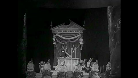 CIRCA 1950s - Scenes from a 1950s era stop motion and live action film of Alice and Wonderland.