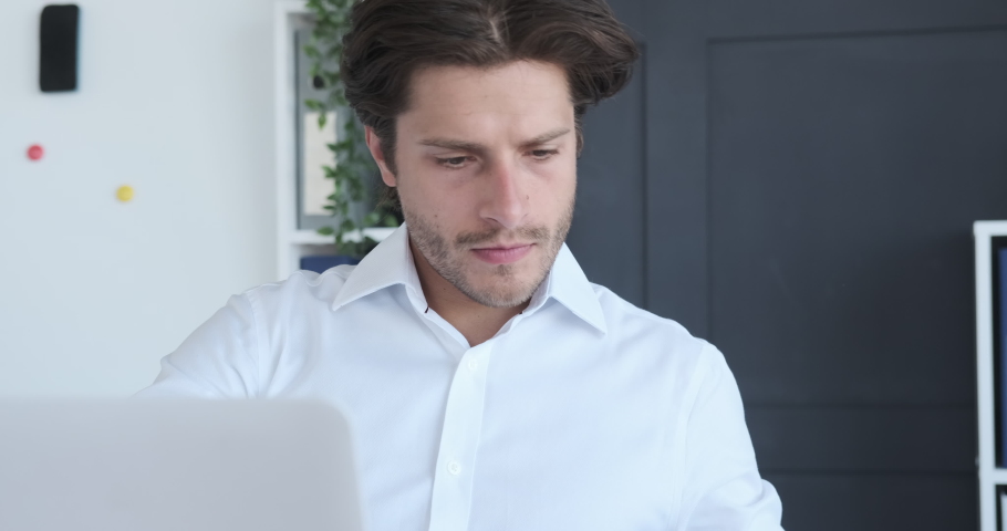Businessman reading documents at office